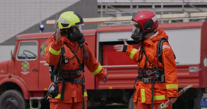 A team of firefighters comes together to celebrate and share their joy and relief after a successful operation, demonstrating the strong bond and camaraderie among these heroic individuals