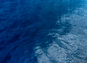 Top view of blue sea water. Blue water background.
