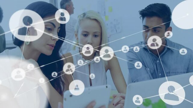 Animating network of connected user icons over diverse colleagues collaborating in office