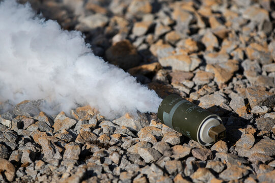 A can of smoke is on the ground