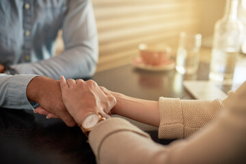 Holding hands, couple and care in cafe, love or affection for partner in relationship, people or...