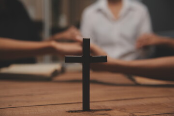 Christian group are praying to god with the bible and sharing the gospel. Concept of faith for god.