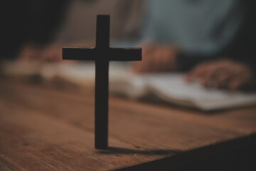 Christian group are praying to god with the bible and sharing the gospel. Concept of faith for god.