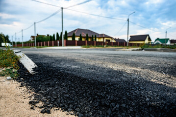 Asphalt road after laying asphalt. New asphalt road renovation. Road construction.