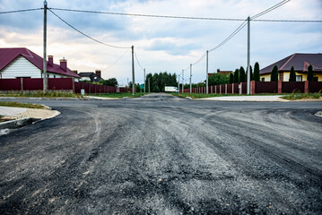 Asphalt road after laying asphalt. New asphalt road renovation. Road construction.