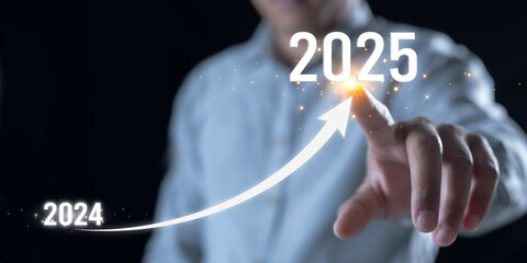 Businessman hand drawing line for increasing arrow from 2024 to 2025 for preparation new year