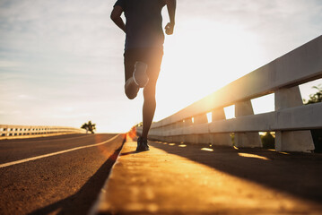 runners is running on the road at outdoors , healthy lifestyle and sport concepts.