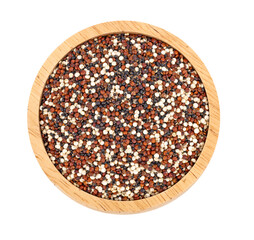 Tri-color quinoa in a wooden bowl, top view