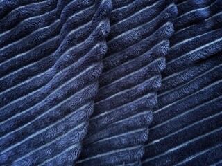 Dark blue fur background texture. wool close-up.