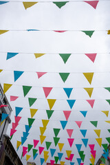 flags in the street in the air bunting