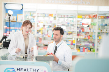 team man and woman pharmacist inspects a medication bottle, ensuring accuracy in prescription filling. pharmacists in patient safety and careful medication handling. operations in retail pharmacy.