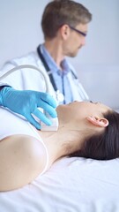 Doctor man wearing blue protective gloves is using ultrasound equipment on the neck of a patient woman, lying for examination. Medicine concept