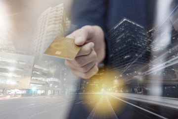 Hand, credit card and businessman with city double exposure for illegal finance deal. Bank fraud, career and financial executive with money embezzlement, tax evasion or bribery with town overlay.