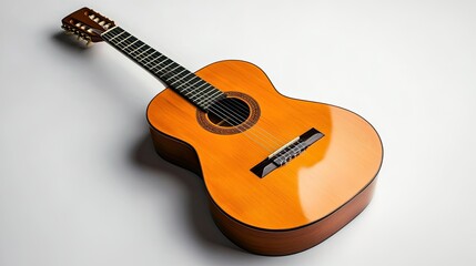 Fototapeta premium A classic guitar with a polished wooden finish, lying on a pristine white surface, emphasizing its simple beauty.