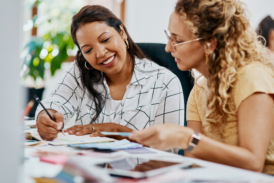 Discussion, team and business women writing notes, brainstorming ideas and smile in startup office. Collaboration, book and manager planning solution or creative product designer review color swatch