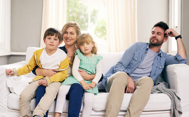 Family, sofa and happy in house for relax, bonding and support with parents, love or playful. Mother, dad and children in living room for comfort, relationship or jealous together on weekend on couch