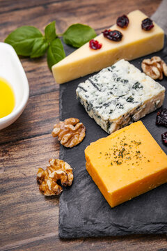 Top view of assorted cheeses with complementary ingredients