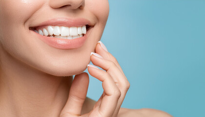 Fototapeta premium Woman's smile white teeth beautiful skin tone and hands. Teeth healthcare concept. Pastel blue background. Copy space.