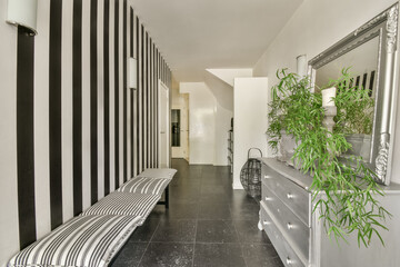 Modern hallway interior with striped accent wall