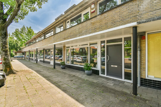 Quiet street scene with a row of commercial spaces