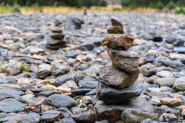 Stacked rocks on a pebbled ground