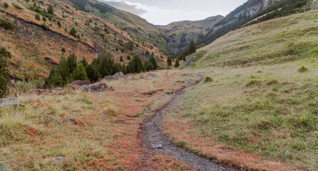 Panoramic landscape with a path in the mountains, on a sunny day. In Pirineos, Huesca (Spain).