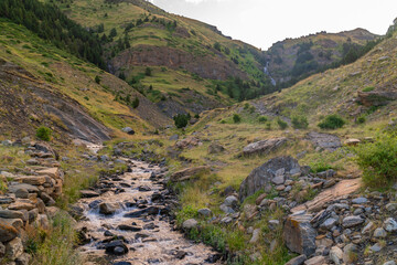 Panoramic landscape with a path in the mountains, on a sunny day. In Pirineos, Huesca (Spain).