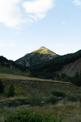 Sunrise in the mountains, blue sky with clouds, in the Pyrenees, Huesca (Spain).