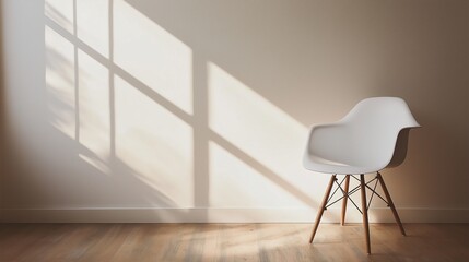 white chair placed against a neutral wall