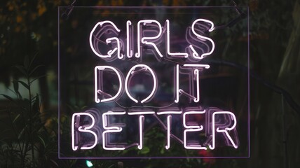 A neon sign that says "Girls do it better"