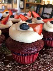cupcakes with icing and fruit 