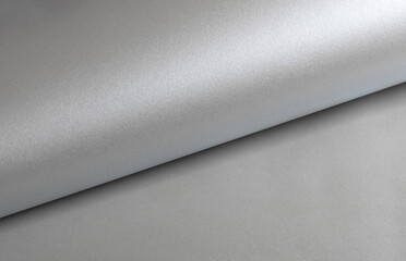 Gray shiny color paper background, smooth glowing shining silver aluminum texture, reflection