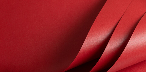 Red scarlet color paper background, smooth glowing shining texture, bent sheets