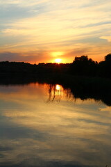 Obraz premium A body of water with trees around it