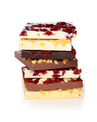 The image shows stacks of gourmet chocolate bars in various flavors, including dark, milk, and white chocolate. Each bar is topped with dried and candied fruits, creating a colorful and indulgent dess