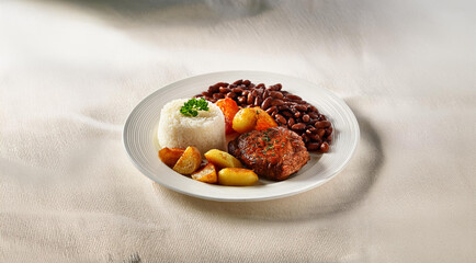 White food plate on a table with white cloth, focus on food, tasty food, full plate, meat, rice, beans, potatoes. Generative AI