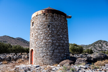 panoramic view of ancient buildings against the backdrop of nature and mountain gardens on a sunny day on the island of Crete in Greece