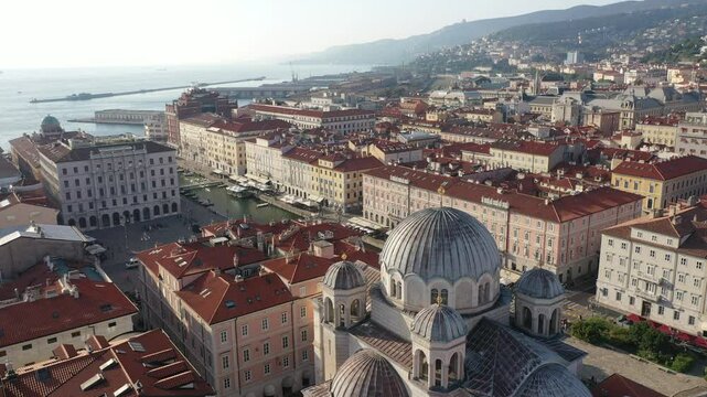 The aerial view of Saint Spyridon Church and Piazza della Libert&agrave; in Trieste, Italy. Historic city landmarks captured from above. Trieste, Italy.