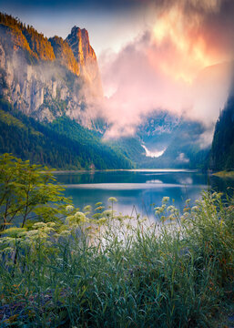 Funtastic summer sunrise on Vorderer lake. Breathtaking morning view of Austrian Alps. Stunning outdoor scene of Hintertal willage, Austria, Europe. Beauty of nature concept background..