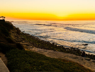 People Watching Sunset on Rocky Beach at La Jolla Cove, La Jolla, California, USA