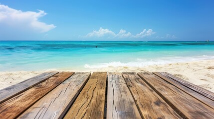 Fototapeta premium A serene beach view from a wooden dock with turquoise waters and a clear blue sky, perfect for relaxation and vacation imagery.
