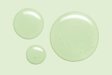 Water serum toner texture. Liquid drops on green background