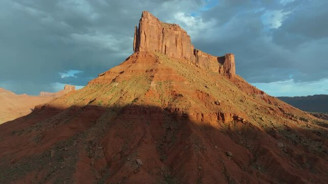 Aerial imagery above Moab desert scene with rocky outcrops and Mesa in 4K
