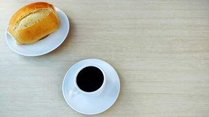  French Bread on the plate and cup of coffee with copy space.

