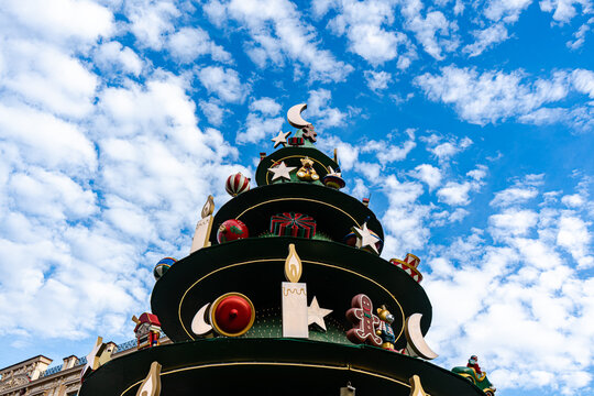 Spiraling Christmas tree decoration against blue sky in Tbilisi
