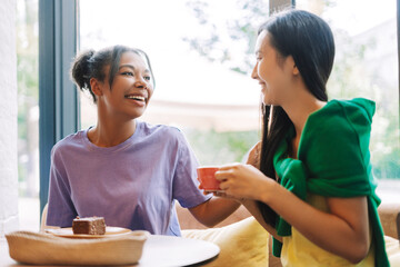 Two female friends sharing a moment together at local coffee shop