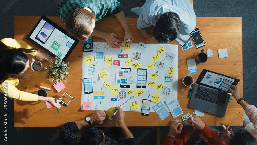  top view of developer team sharing idea of ux ui design by using mind map. top down view of group of