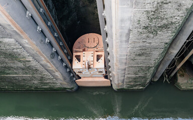 Massive Lock Gate Mechanism with Concrete Walls and Green Water