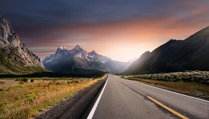 the only road single road leading to mountains through a surreal landscape