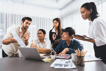 Data analysts team of office worker collaborate on business intelligence BI dashboard to analyze financial, trend, and marketing data. BI software utilization drive business success. Prudent